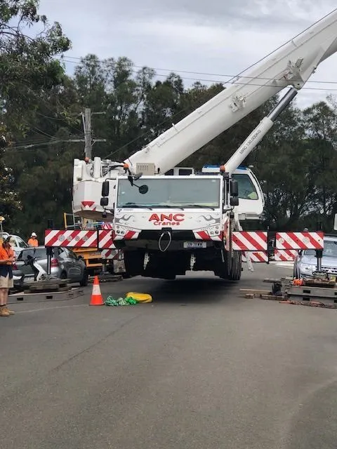 Above All crane truck and traffic control on a Sydney street after a tree came down